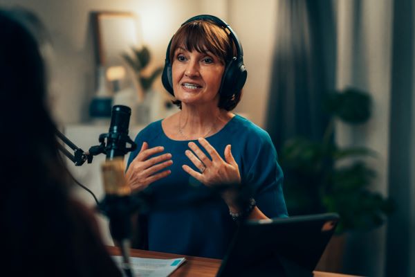 Adult man comfortably reading an e-book on a digital tablet
